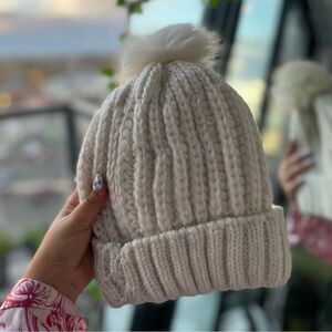 White beanie with pom pom